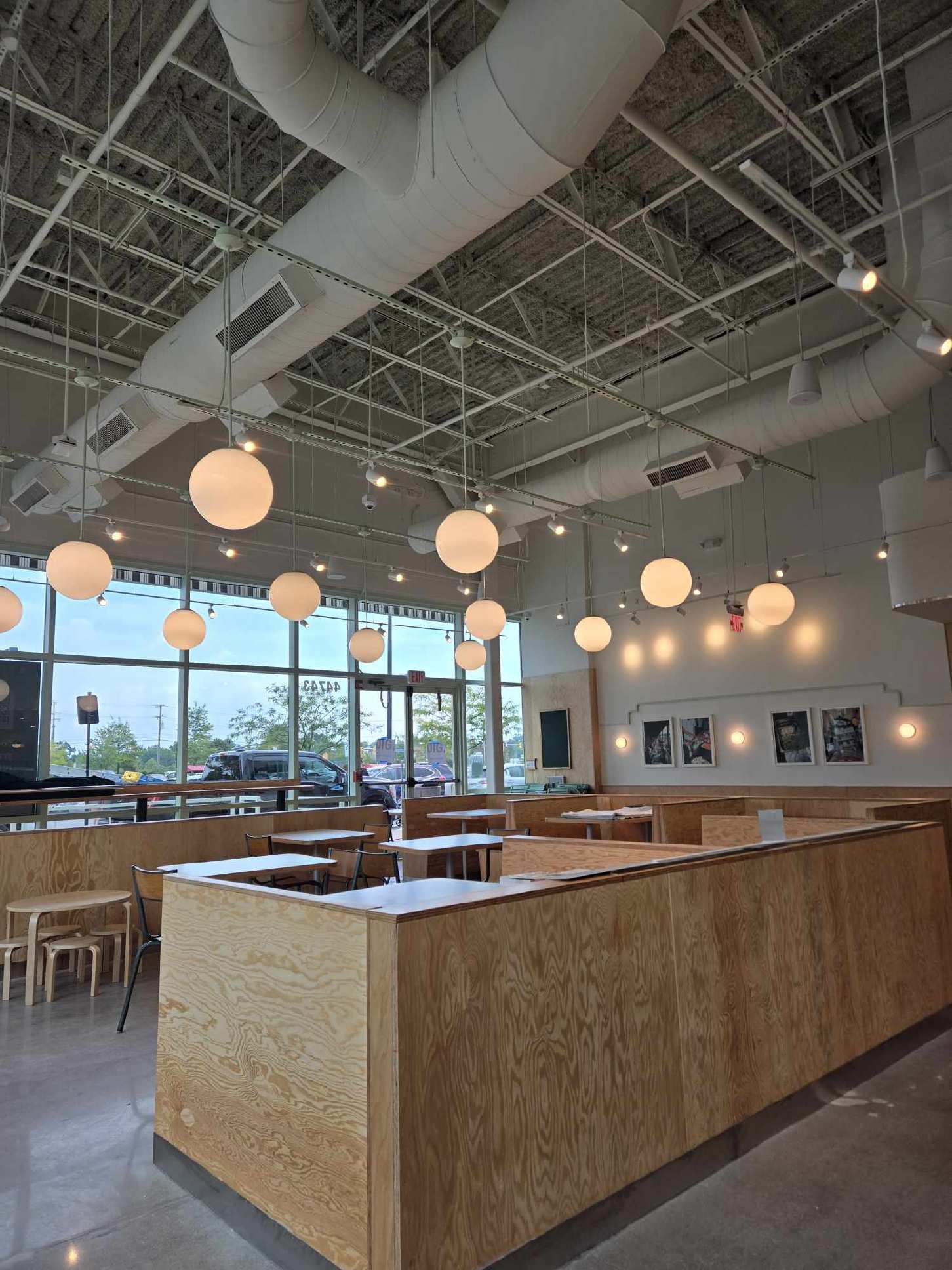 Restaurant dining area with globe pendant and track lighting