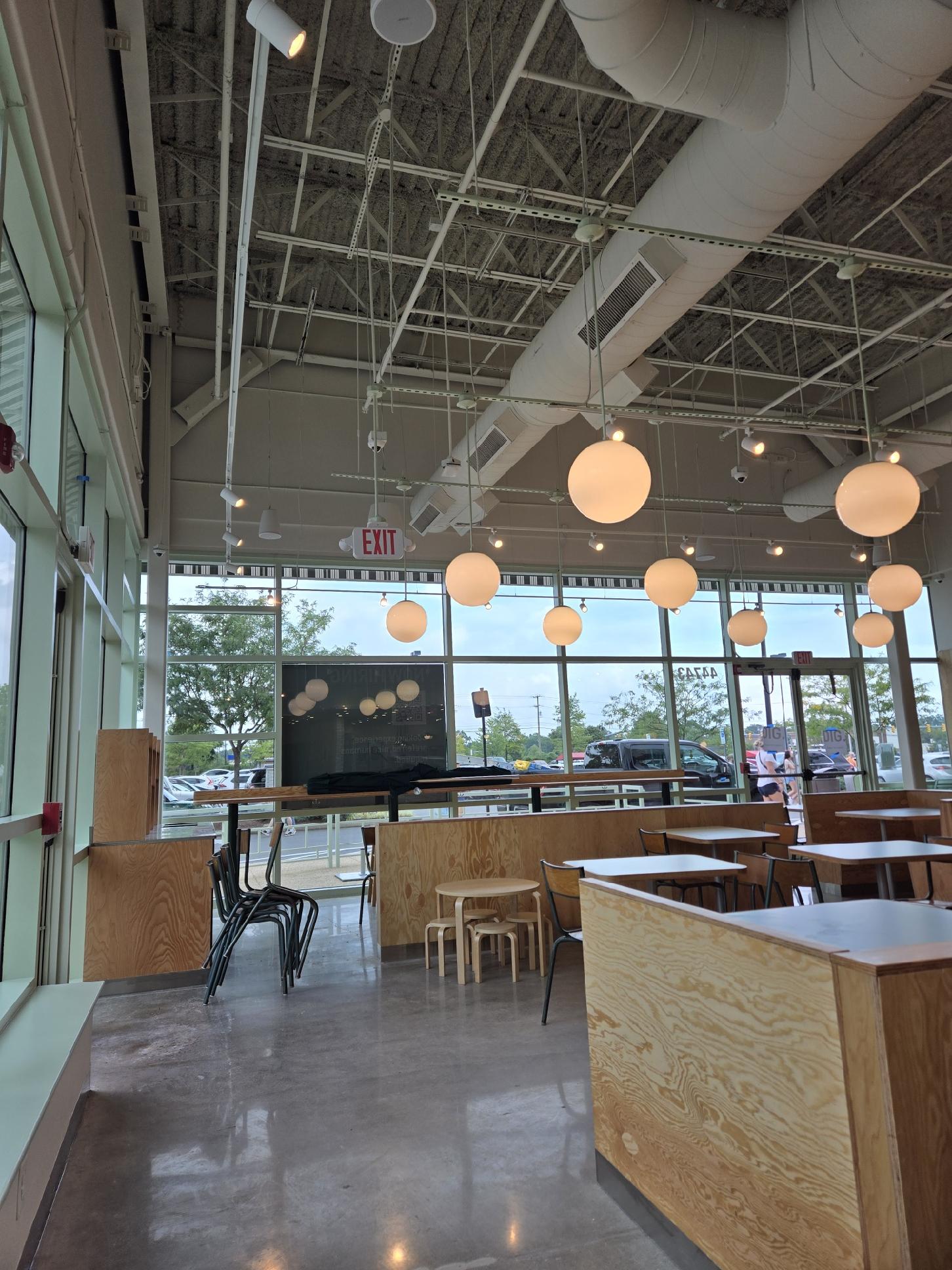 Restaurant pendant and globe lighting with exposed conduit